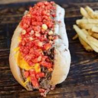 South Paw · Shaved steak, onions, Swiss American cheese, cheese sauce and flamin' hot cheetos.