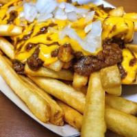 Chili Cheese Fries · Fried potatoes topped with cheese and chili.