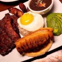 BANDEJA PAISA · white rice, black beans, fried egg, maduros, white arepa, pork, steak, colombian chorizo & a...