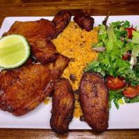 FRIED PORK CHOP · savory rice with pigeon peas spiced with homemade sofrito. Signature rice dish of Puerto Ric...