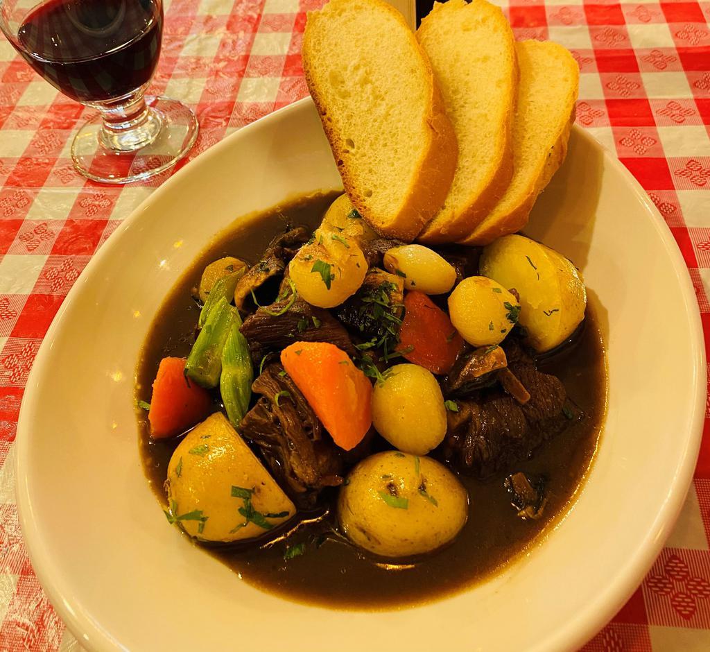 Beef Bourguignon · Traditional French Stew , Slow cooked Beef in wine  Sauce with mushrooms, potatoes and pearl onion. 