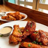 Jumbo Chicken Wings · Crispy fried wings honey chipotle or hot sauce