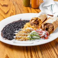 LA Burrito · Refried beans, cheese, and choice of filling wrapped in a flour tortilla - served with yello...