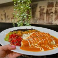 Enchiladas · Choice of filling and fresh white cheese rolled in corn tortillas and smothered in a red anc...