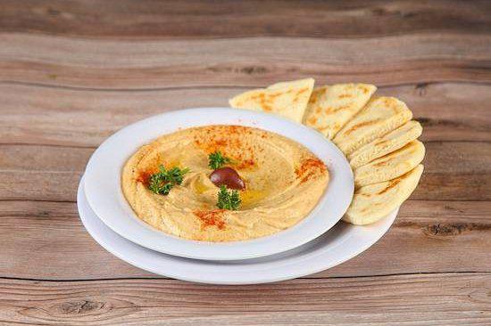 Small Hummus · House blended garbanzo beans, tahini, olive oil, fresh garlic, lemon juice, and our special seasonings. Served with 1 pita bread