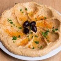 Large Hummus · House blended garbanzo beans, tahini, olive oil, fresh garlic, lemon juice, and our special ...