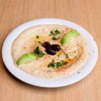 Small Baba Ghanoush · Roasted eggplant, tahini, olive oil, garlic and lemon juice all blended together. Served wit...