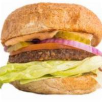Veg Text Burger · Seasoned black bean patty, lettuce, tomato, onions, pickles and choice of sauce and cheese.
