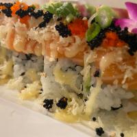 Winter Roll · Tuna and avocado inside with salmon, sweet sauce, tempura flakes, scallion, red, and green t...