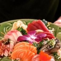 Sashimi Deluxe · 19 slices. Chef’s choice of assorted slices of raw fish, served with side of white rice.