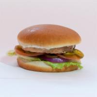 Salmon Burger · Yummy wild Alaskan salmon patty, lettuce, tomato, onion, jalapeno, and white yogurt sauce. 