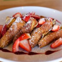 French Toast with Fresh Strawberries · Panfried bread.
