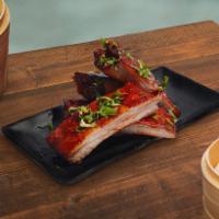 BBQ Spare Ribs · Four roasted ribs lightly brushed with our (made from scratch) Cantonese barbecue sauce.
