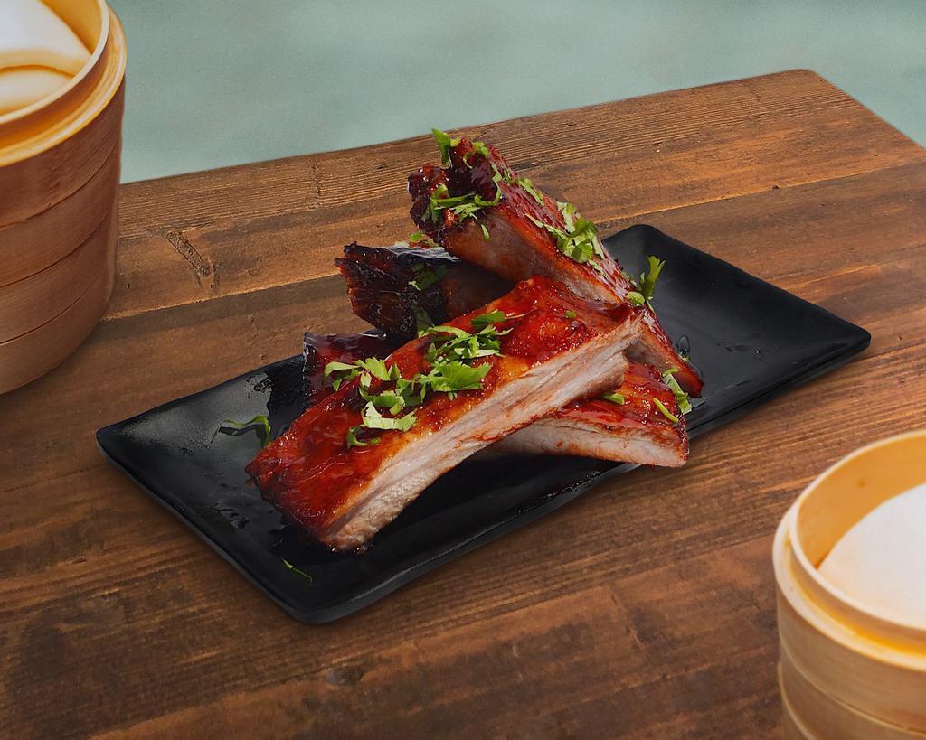 BBQ Spare Ribs · Four roasted ribs lightly brushed with our (made from scratch) Cantonese barbecue sauce.