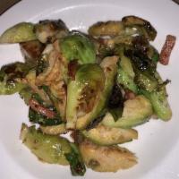 Sauteed Brussel Sprouts With Bacon · Served with garlic and bacon.