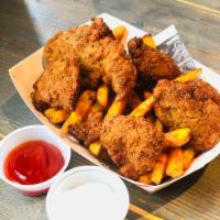 Chicken Nuggets Basket · Served with Cajun Fries