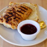 Toasted Cheddar Buttermilk Biscuit · Served with butter and Atwater's jam.