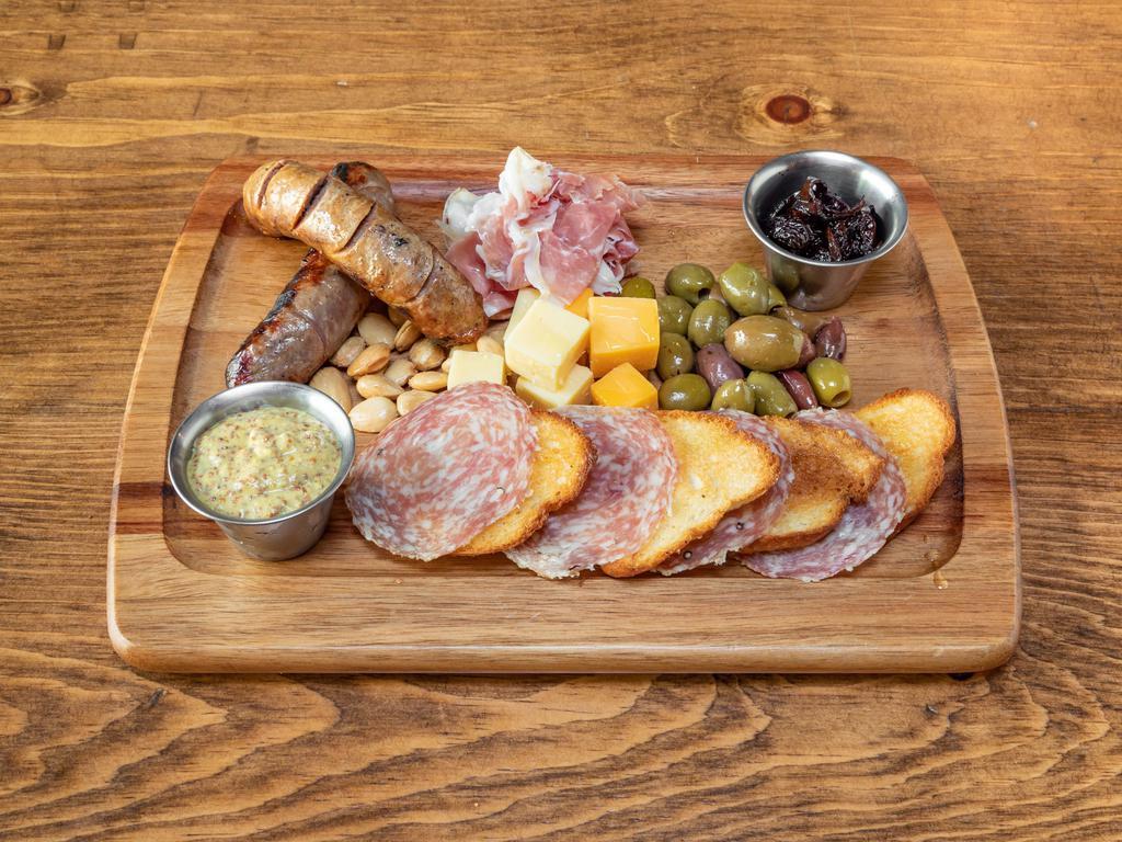 Sausage and Charcuterie Board · andouille sausage, beer braised brat, prosciutto di parma, soppressata, Irish cheddar, balsamic and cherry braised onions, Marcona almonds, house marinaded olives, crostini, Haus mustard