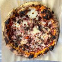 The Butcher Pizza · Italian sausage, smoked black forest ham and bacon.