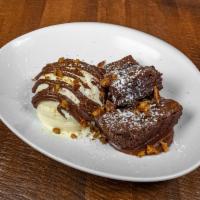Hot Fudge Brownie · Warm brownie, vanilla bean ice cream, haus made chocolate sauce, spicy walnuts, powdered sug...