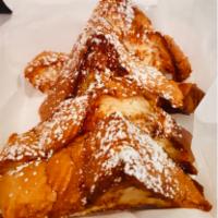Classic Challah French Toast · Rated No. 1 in Chicago
Grand Slices of Fresh Challah Bread Dipped & Griddled.