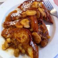 Bananas Foster French Toast · Grand Slices of Challah Dipped and Griddled then topped with our own Bananas Foster.