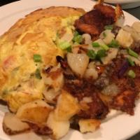 Fran's Omelette · Roasted potatoes, Smoked Bacon, Grilled Onions & Cheese. 
Served  with your choice of Home p...