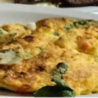 Spinach and Tomato Frittata · Baked Open Face Omelette, Scrambled Egg with Fresh Spinach and Tomatos topped with a Parmesa...