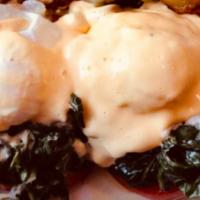 Florentine Benedict · Poached eggs, creamed spinach and tomatoes topped with Hollandaise. Served over a toasted En...