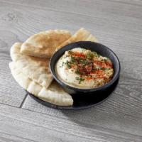 Hummus · Served with pita bread.