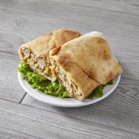 Chicken Shawarma Wrap · Thinly sliced chicken cooked on a slow rotisserie, tomato, and pickle. Served with garlic sa...