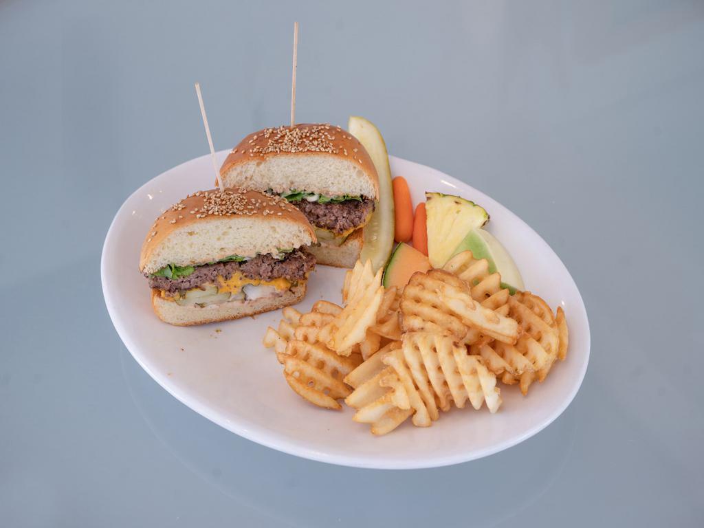 The Bigger Mac Burger · 1000 Island dressing, lettuce, American cheese, pickles and onions on our toasted sesame roll.
