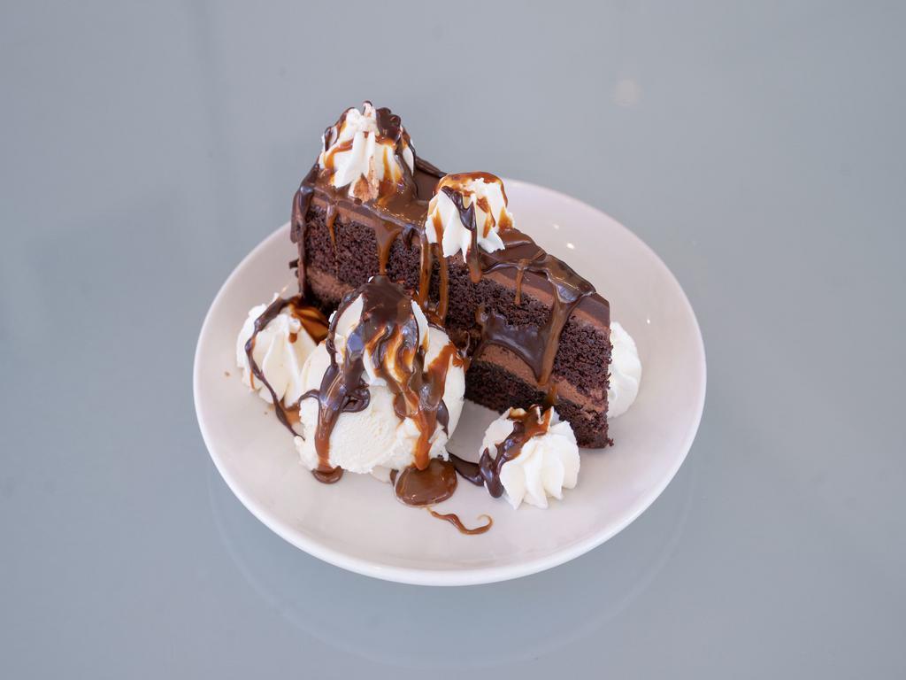 Chocolate Mousse Cake · Local pastry legend Tracy Dempsey creates this decadent fleur de sel caramel chocolate
mousse cake. We garnish it with Kopp’s hot fudge, butterscotch and fresh whipped cream.