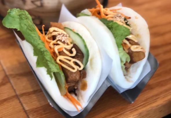 Pork Bun (per piece) · Braised pork belly in a bao bun topped with lettuce, shredded carrots, sesame seeds, spicy Japanese mayonnaise and our house sauce.


