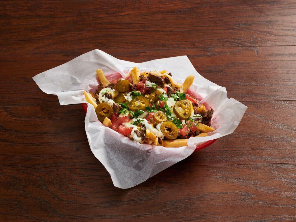 Asada Fries · Includes french fries with choice of meat, beans, cheese, guacamole, sour cream, jalapeno peppers, tomatoes and pico de gallo.  Anything else added to this is an extra charge.