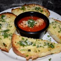 Garlic Bread Plate · Roasted garlic, EVOO, parsley, Parmesan, sea salt and side of marinara.
