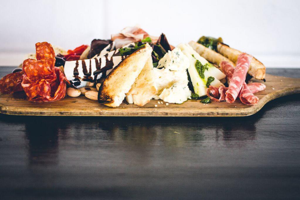 Meat and Cheese Board Plate · Prosciutto, salami, sopressata, artisan cheese, olives, nuts and crostini.