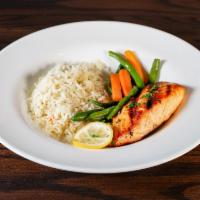 Grilled Salmon  · Filet served with seasoned rice and fresh vegetables.  Herb butter upon request.