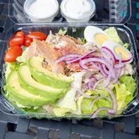 Cobb Salad · Chicken, bacon, romaine lettuce, tomatoes, red onions, avocado and eggs with blue cheese dre...