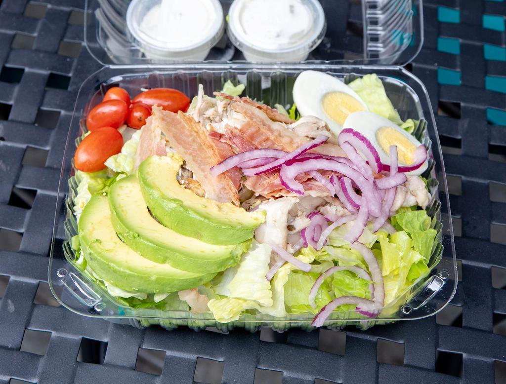 Cobb Salad · Chicken, bacon, romaine lettuce, tomatoes, red onions, avocado and eggs with blue cheese dressing.