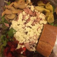 Tweet Salad · Spring mix lettuces, artichoke hearts, marinated mushrooms, roasted peppers, and crumbled fe...