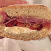 Gigolo Sandwich · Prosciutto, tomato, fresh mozzarella, olive oil, and sun-dried tomato on a soft roll.