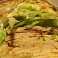 Napa Sandwich · Cracked pepper turkey, brie cheese, chipotle aioli, lettuce, tomato, and onions on a sourdou...
