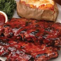 Fall-Off-the-Bone Baby Back BBQ Ribs · Baby back ribs slow roasted and caramelized on the grill with our signature BBQ sauce.