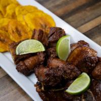 Picalonga · Mixture of chopped fried pork, sausage with plantains and lemon