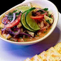 Ceviche · Shrimp, Octopus, Calamari, prepared with tomato, lemon and onions. Served w/crackers.