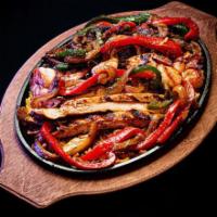Beef Fajitas · Beef fajita are made with your choice of meat grilled onion,           pimiento pepper serve...