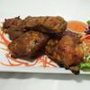 55 - BBQ Spare Ribs.. · Char-broiled pork ribs marinated with house Thai style BBQ sauce served with sweet-sour sauce.