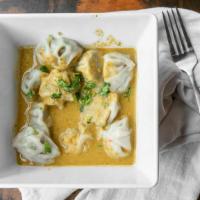 Jhol Momo Chicken · Momo served in Chef’s special Himalayan soup.