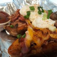 Stuffed Potato Skin · Our own pulled pork slathered in BBQ sauce, stuffed into deep fried potato skins, topped wit...